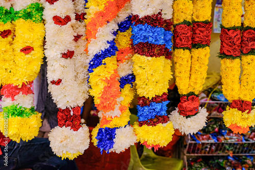 Close up of garlands of colourful fresh flowers for worshipping, and events like child birth, weddings and funerals. selective focus