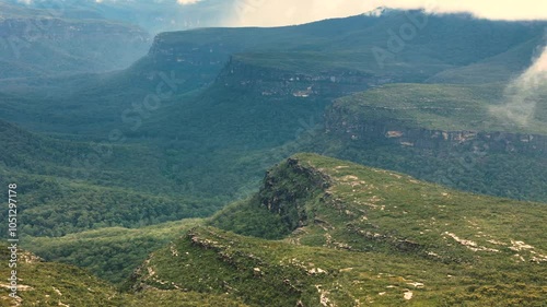 Aerial panoramic establishing overview of Morton National Park with rolling hills, green forests, and expansive wilderness, NSW, Australia photo