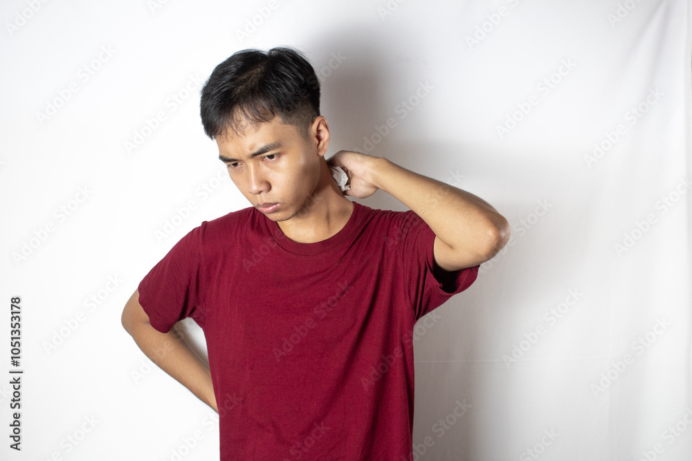Asian teenager with back neck pain Asian teenager with back neck pain