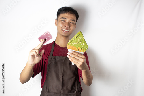 smiling teenage bartender with snacks and cards in his hand