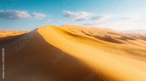 Golden Sand Dunes Desert Landscape with Blue Sky and Clouds