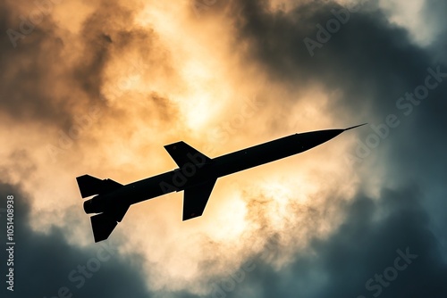 Silhouette of cruise missile flies against dramatic sky, war, tension, military, air defense missile, air defence