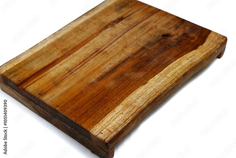 Square wooden cutting board isolated on white background with 45 degree angle setting Square wooden cutting board isolated on white background with 45 degree angle setting