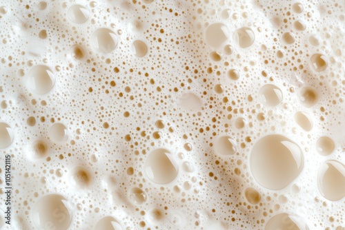 Freshly poured frothy pasteurized milk topped with a thick, creamy foam, perfect for coffee or breakfast. photo