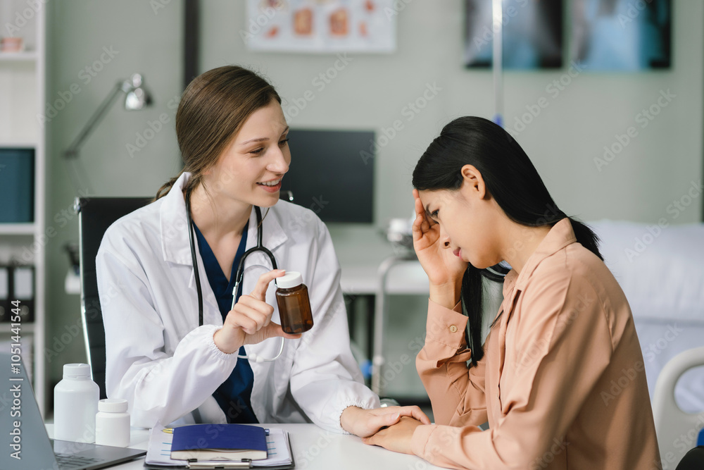 Female doctor and patient are talking and consulting at the table in a medical clinic or hospital health service. Female doctor and patient are talking and consulting at the table in a medical clinic or hospital health service.