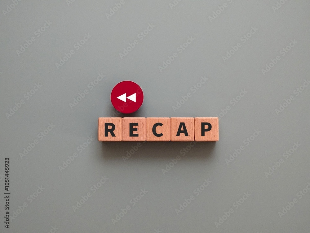 © Nijaomei - wooden cube with the word Recap and back arrow. flashback concept. business finance