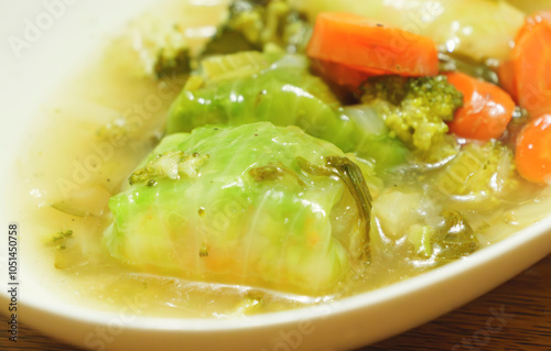 Cabbage rolls, a Western dish of meat or seafood wrapped in fresh cabbage and simmered in a warm broth photo