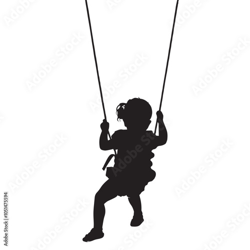 Black silhouette of baby girl flying high with fun on rope swing