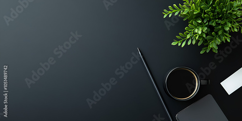 Modern Workspace with Coffee Cup and Plant

