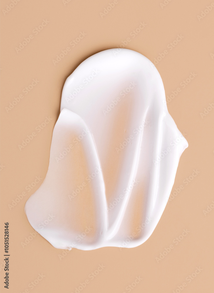 creamy smear of white cosmetic texture on beige background skin care concept creamy smear of white cosmetic texture on beige background skin care concept
