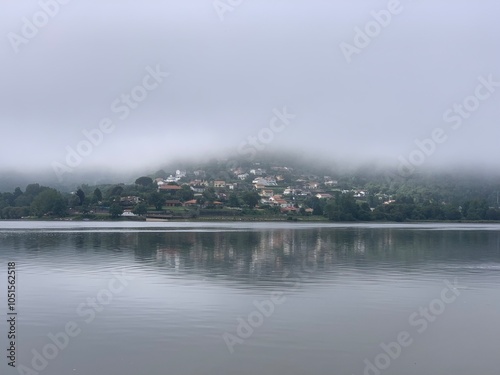 Thick fog over the river Minho and surrounding landscape in Eiras, O Rosal, Galicia, Spain, June 2022