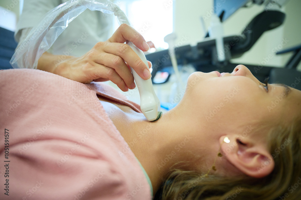 Close up of doctor making thyroid sonogram for kid. Pediatric ...