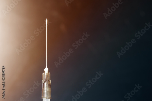 Closeup of medical syringe needle with copy space