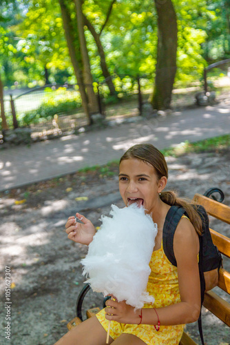 Wallpaper Mural Child eating cotton candy in the park. Selective focus. Torontodigital.ca