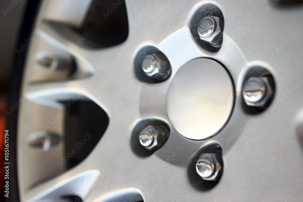 Car detail shot. Wheel plug selective focus close up.