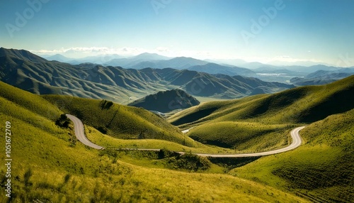 Scenic Winding Road Through Rolling Hills and Mountains
