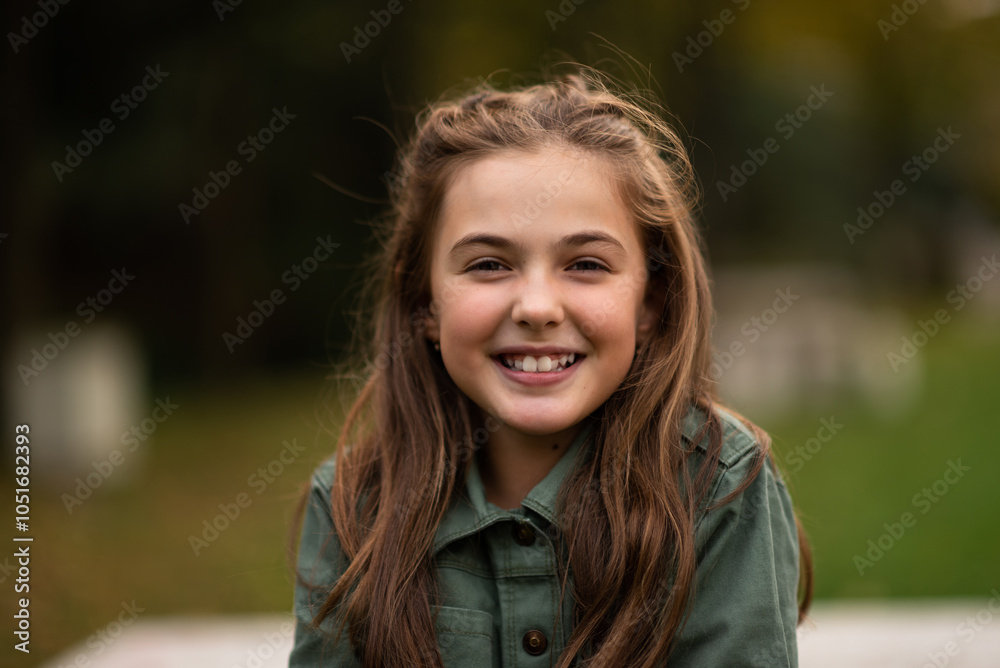 Portrait of a happy child girl looking at camera and smiling. Portrait of a happy child girl looking at camera and smiling.