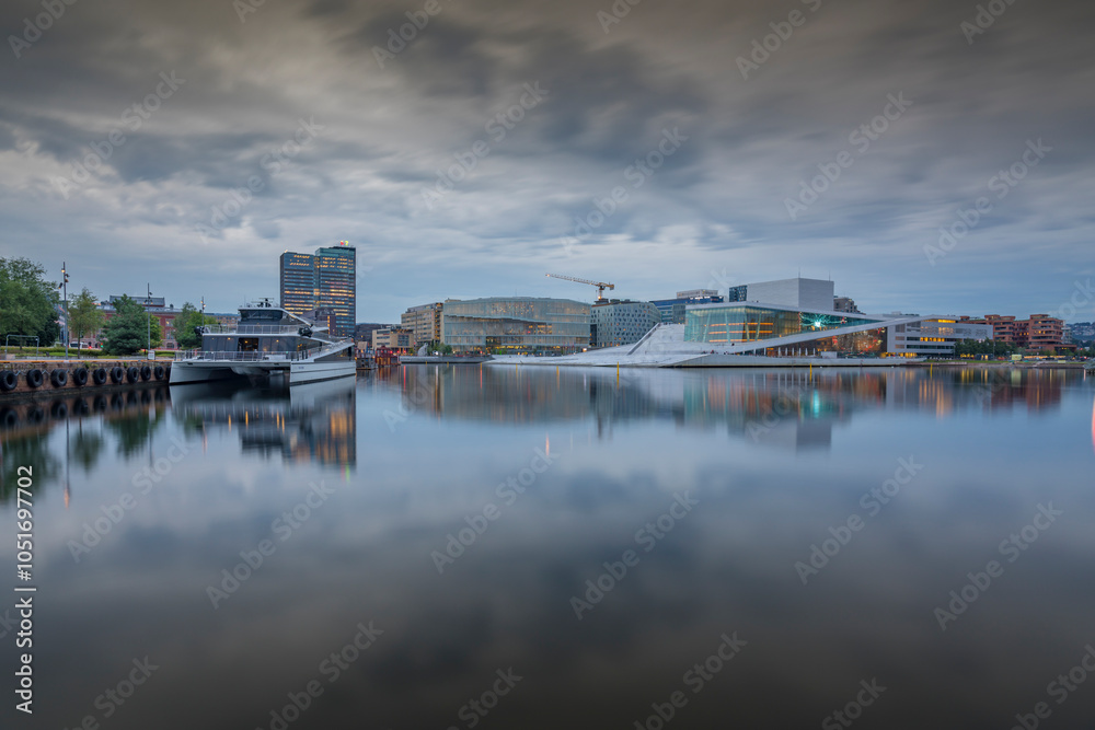 View of Oslo Opera House and Munch Museum reflecting in harbour on cloudy day, Oslo, Norway, Scandinavia, Europe View of Oslo Opera House and Munch Museum reflecting in harbour on cloudy day, Oslo, Norway, Scandinavia, Europe