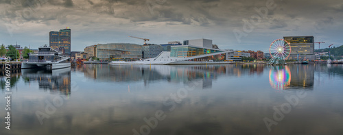 View of Oslo Opera House and Munch Museum reflecting in harbour on cloudy day, Oslo, Norway, Scandinavia, Europe photo