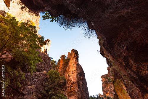 Looking up at the steep red cliffs from the suspension bridge in the gorge of Los Cahorros Monachil, Monachil, Sierra Nevada, Granada, Andalusia, Spain, Europe photo