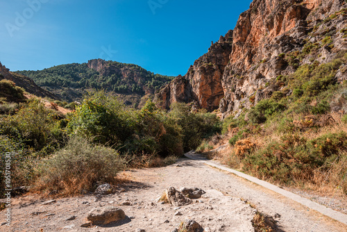 Hiking trail in the arid gorge canyon landscape of Los Cahorros Monachil, Monachil, Sierra Nevada, Granada, Andalusia, Spain, Europe photo