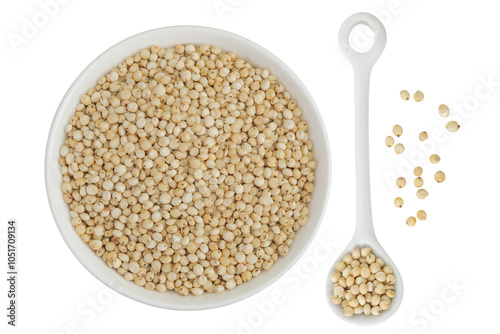 Sorghum seeds in ceramic bowl isolated on white background. Top view. Flat lay.