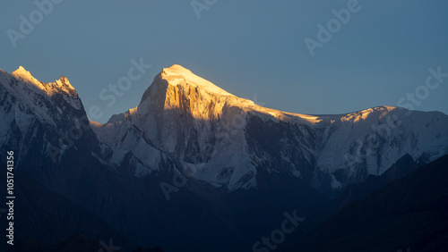 Beautiful mountain landscape view of snow-capped Spantik aka Golden Peak in Karakoram range at sunset, Hunza, Gilgit-Baltistan, Pakistan photo