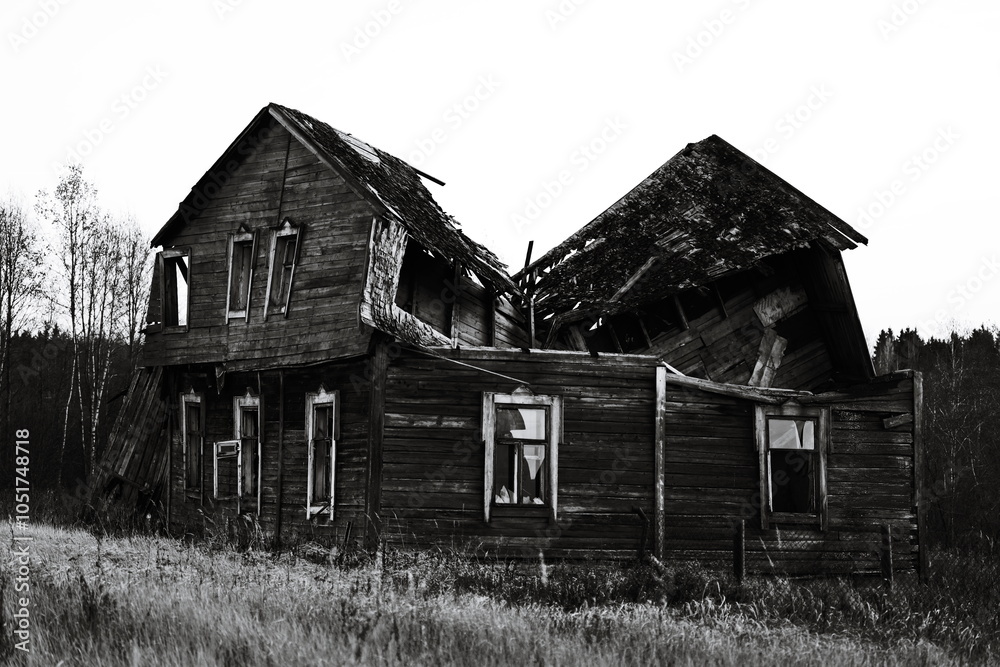 A classic black and white photo of an old house's facade. A classic black and white photo of an old house's facade.