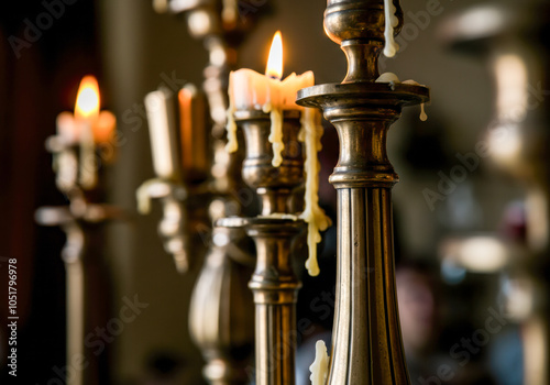 Elegant brass candle holders with lit candles showcasing warm ambiance in a cozy interior setting during evening hours