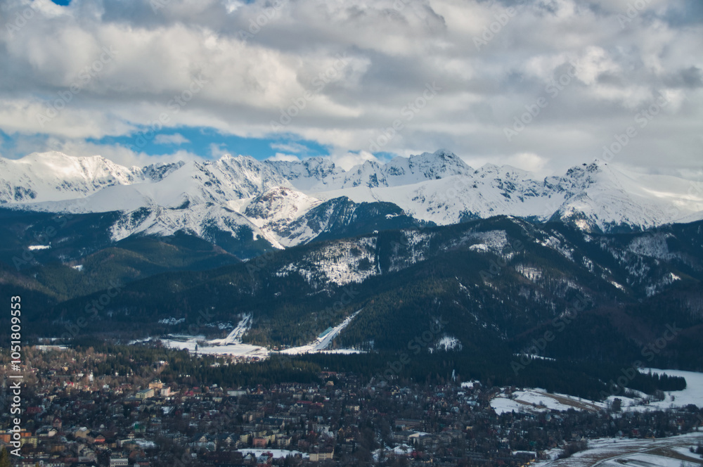 Fototapeta premium Snow-covered mountain peaks in the Tatras above the town of Zakopane in the Polish mountains