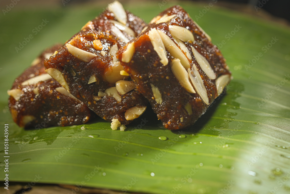 cashew halwa placed on banana leaf,an indian sweet cashew halwa placed on banana leaf,an indian sweet
