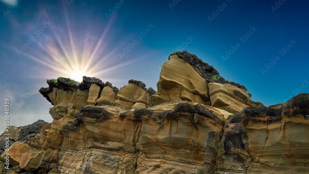 Stunning amazing rocky coast view at sunset ,beautiful bay,rock, sun rays,blue sky in Xiaoyeliu Geopark,Taitung,Taiwan For branding,calendar,postcard,screensaver,wallpaper,poster,banner,cover,website.