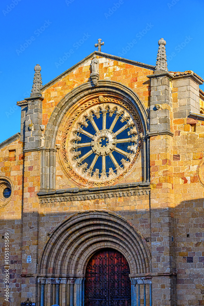 Obraz premium Ancient stone facade and skylight of the Parish of St. Peter the Apostle, Avila, Spain