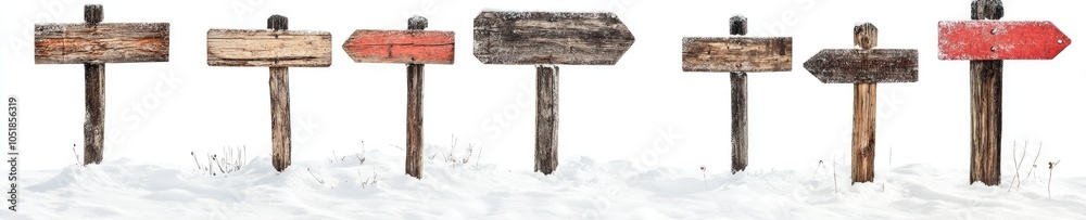 Naklejka premium A row of wooden signs with arrows pointing in different directions