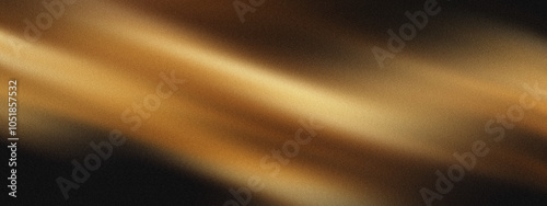 blurred gradient of golden and black hues with glowing effect, abstract grainy background