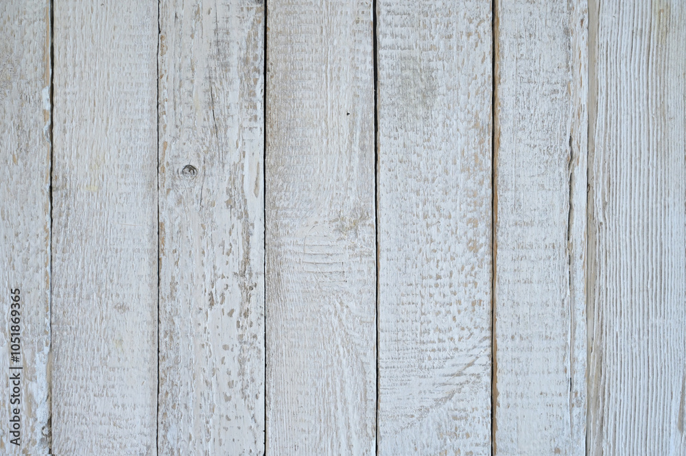 Naklejka premium White background from vertical wooden boards. Each board has a natural texture with slight bumps, small knots and visible wood grain.