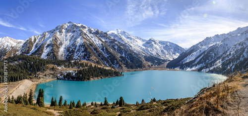 Fototapeta Naklejka Na Ścianę i Meble -  Beautiful mountain lake with ice and snow. Big Almaty lake in winter time. Kazakhstan.