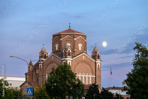 The Tempio della Pace church illuminated by the full moon in the evening sky of Padua, Italy