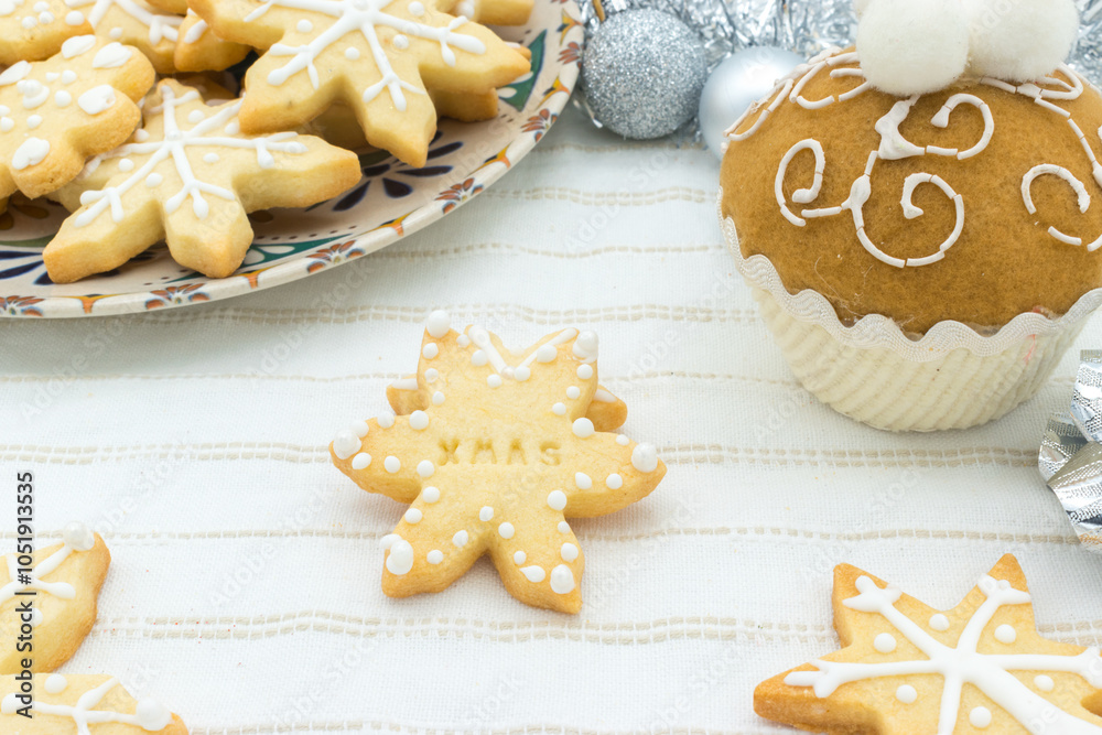 Fototapeta premium Snowflake-shaped sugar icing Christmas cookie with the message 