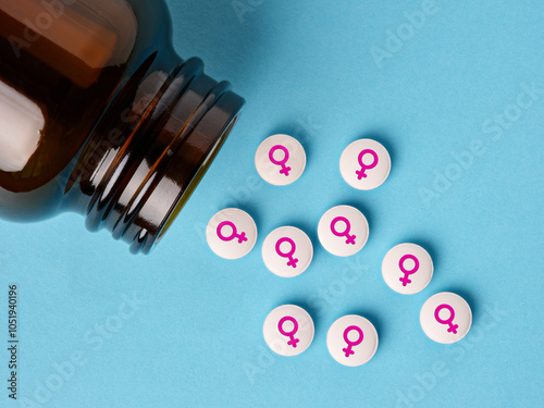 Canvas Print Medical hormone pills with female symbol spilling out of the bottle