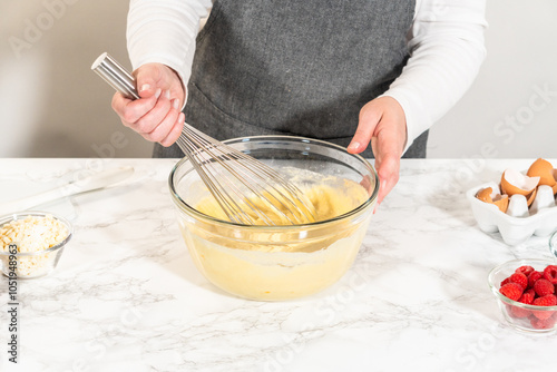 Wallpaper Mural Whisking Delight - Bundt Cake Batter Preparation Begins Torontodigital.ca