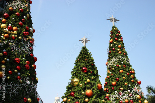 close up Christmas tree with  decoration ball and light bulb on festival time celebrations 