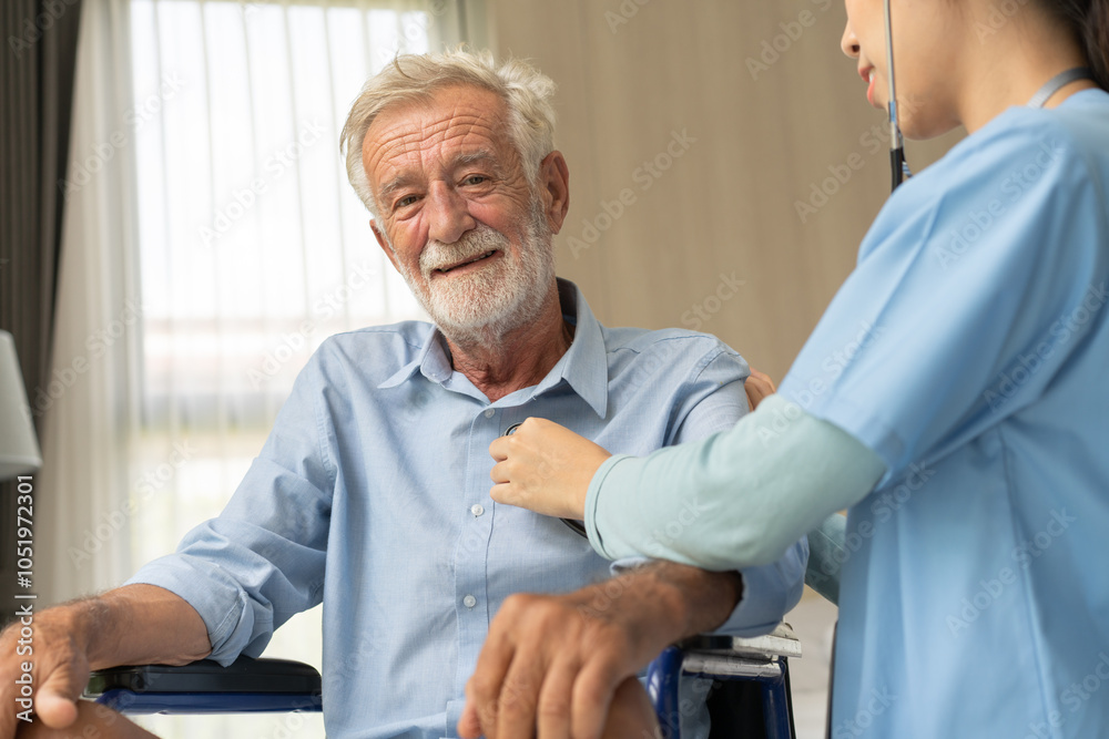 Obraz premium Nurse caregiver using stethoscope checking on heartbeat examining of senior man sitting on wheelchair, Happy grandfather smile and enjoy life after retirement. Therapist take care and support hime