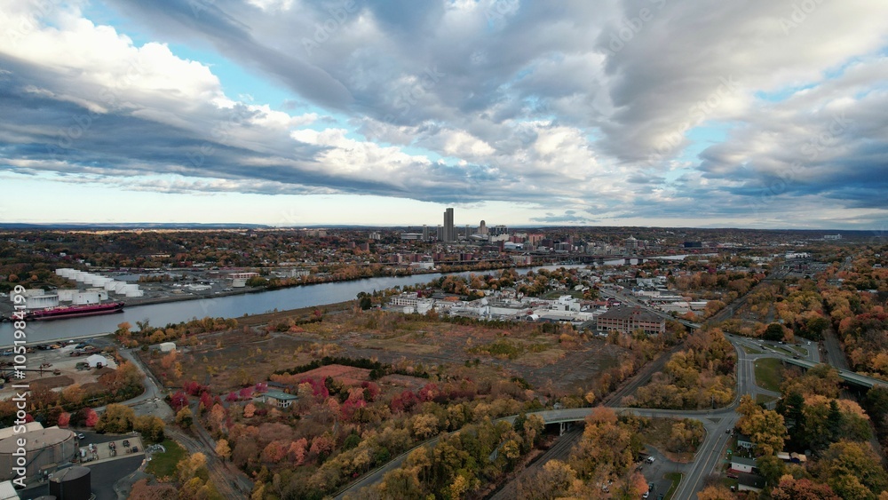 Obraz premium Aerial view of Albany, New York, with the cityscape with vibrant autumn foliage