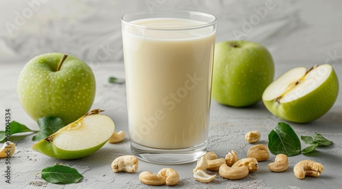 Creamy Apple Cashew Smoothie With Green Apples on a Wooden Table