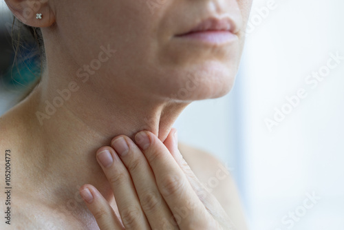 Woman with loose skin on her neck and wrinkles on her face. photo