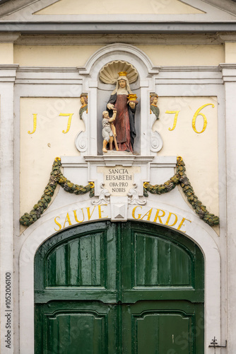 Close up of the entrance gate of the Beguinage Ten Wijngaerde, Bruges, Belgium photo