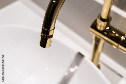 washbasin and faucet in the hotel bathroom photo