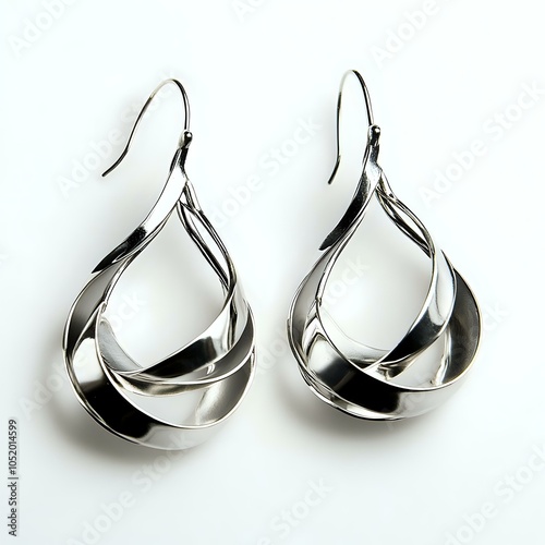 Elegant twisted silver drop earrings with a modern design. photo