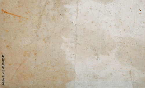 Old Paper Texture. Yellowed Damaged Sheet Of Paper. Old Stained Torn Notebook Page With Brown Stains And A Visible Fold In The Middle Of The Page. Vintage Paper Sheet With Visible Impact Of Time.